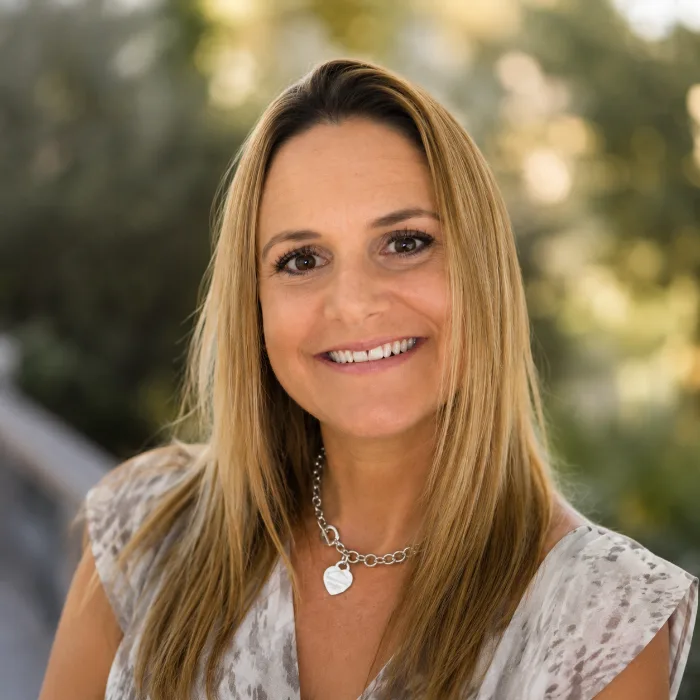 Portrait of Amy Garside, smiling outdoors