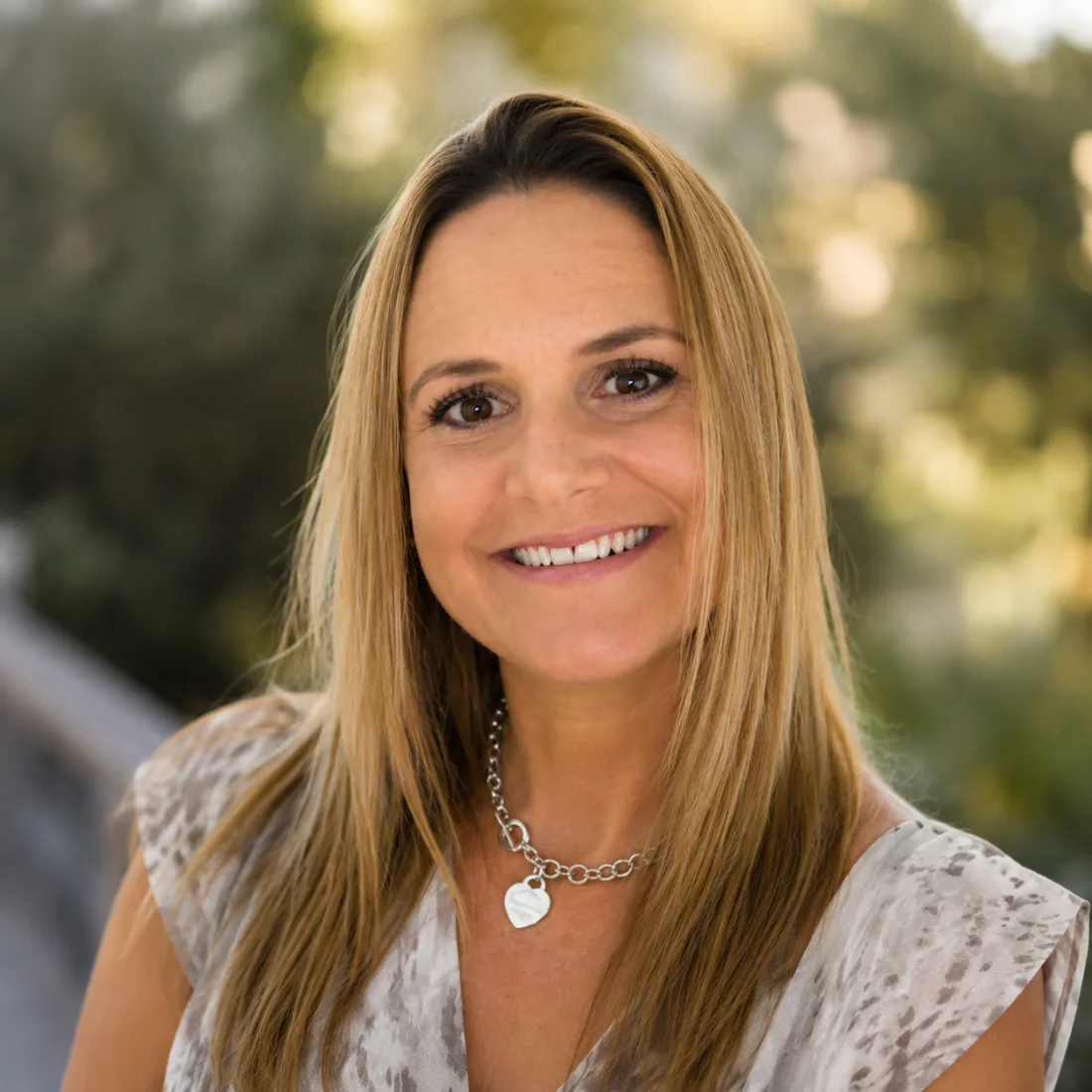 Portrait of Amy Garside, smiling outdoors